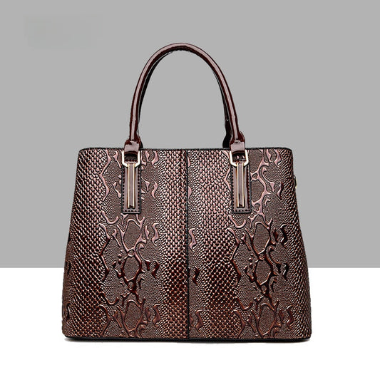 Leather snake-pattern handbag