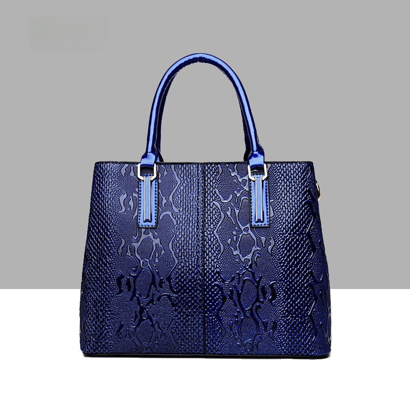 Leather snake-pattern handbag